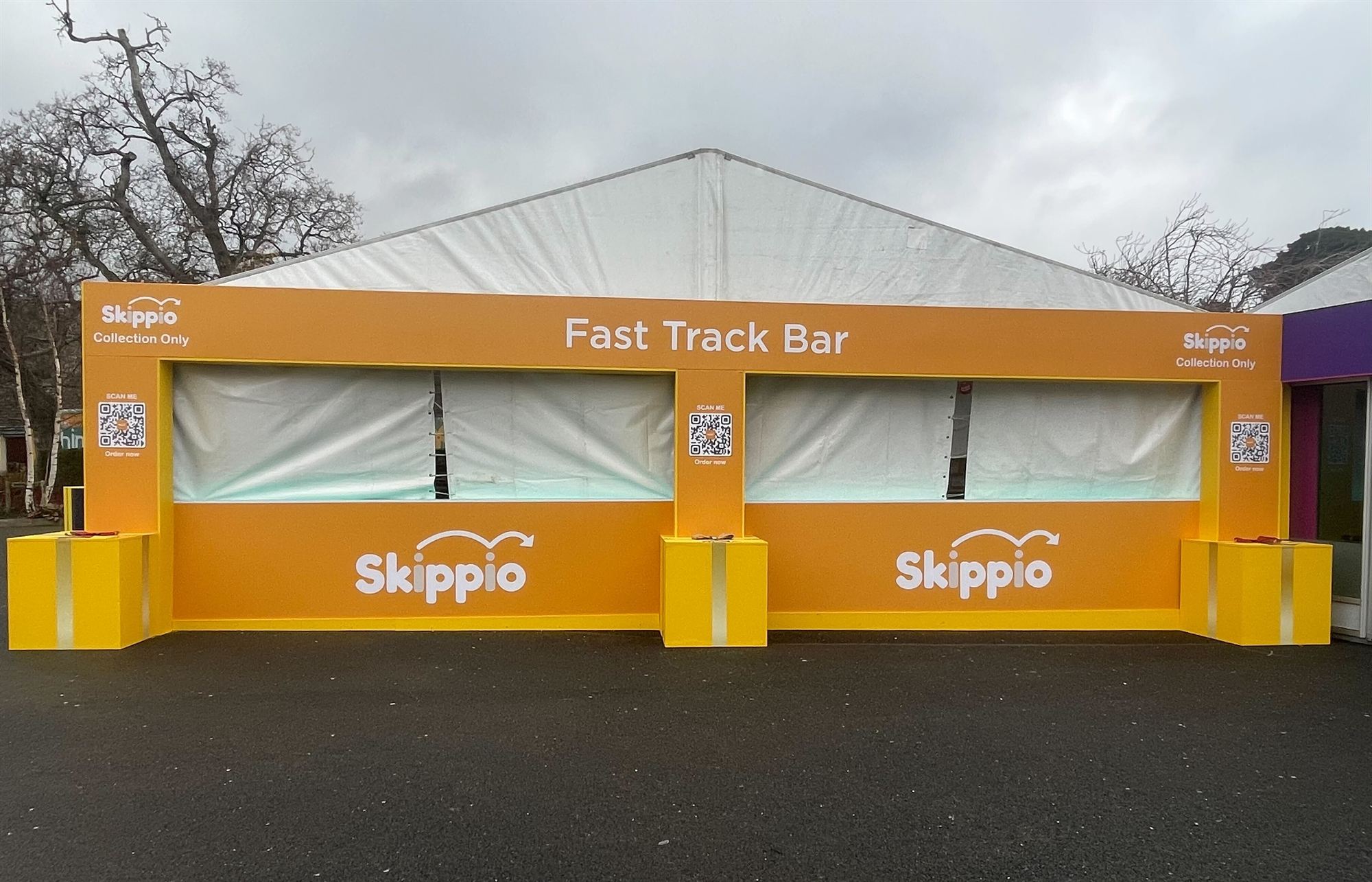 Skippio Fast Track Bar with collection-only QR codes at an outdoor event
